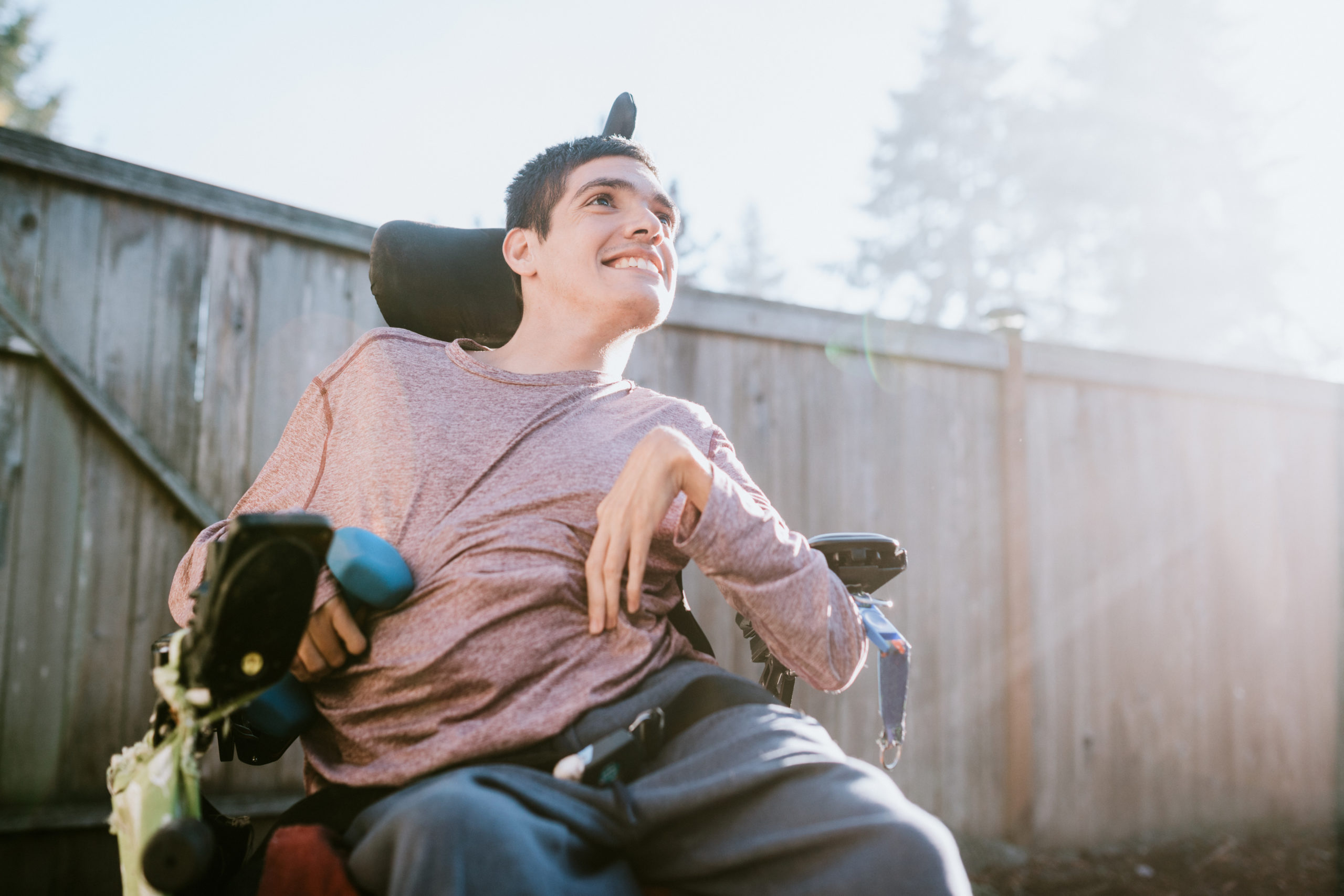 Confident Young Man In Wheelchair At Home