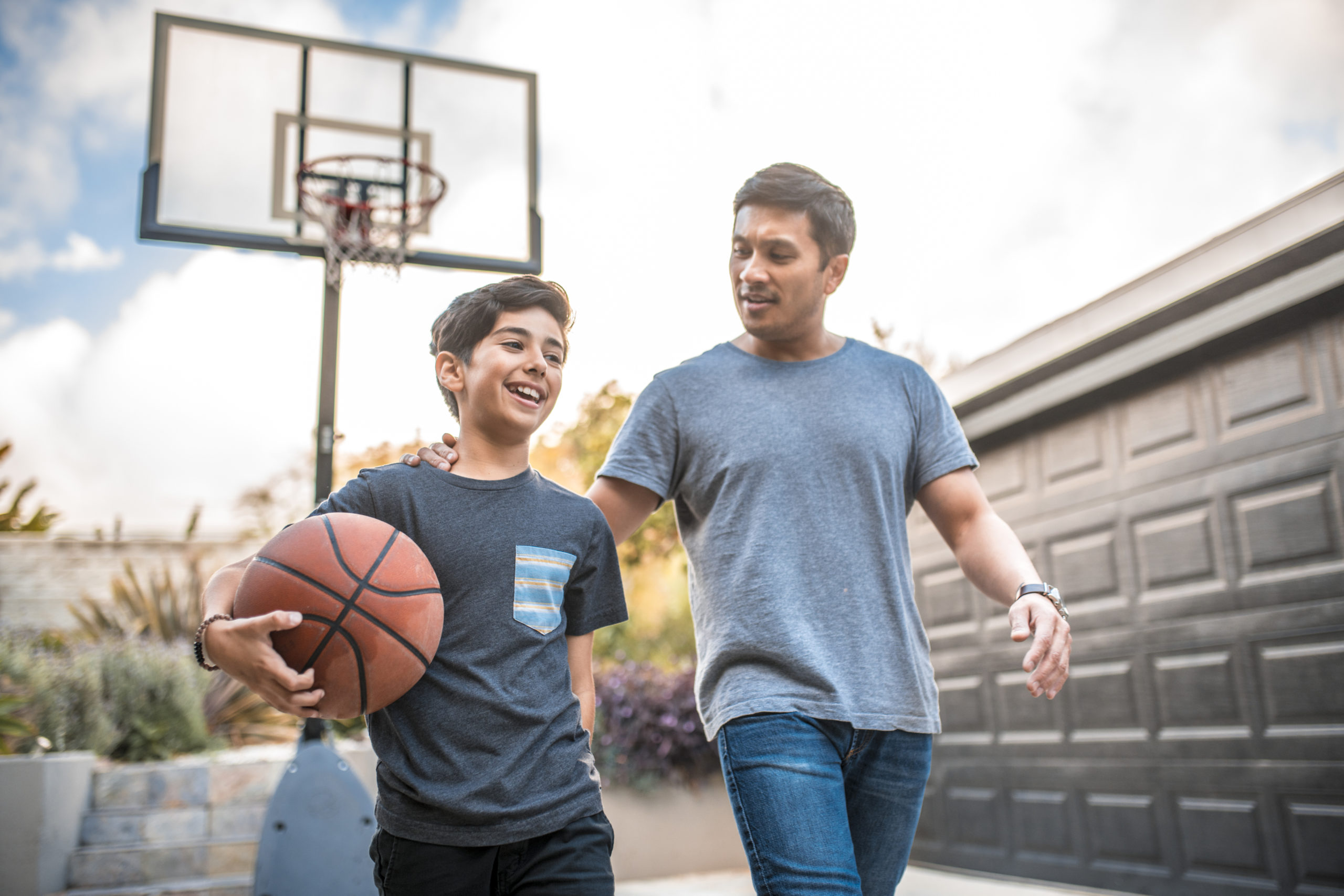 father and son after basketball game